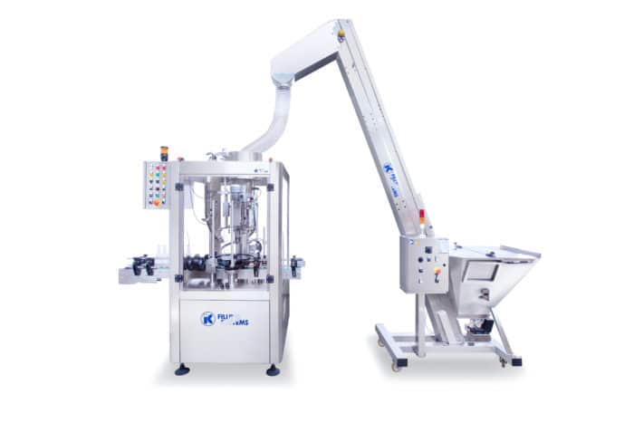 Stand alone capper with elevator
