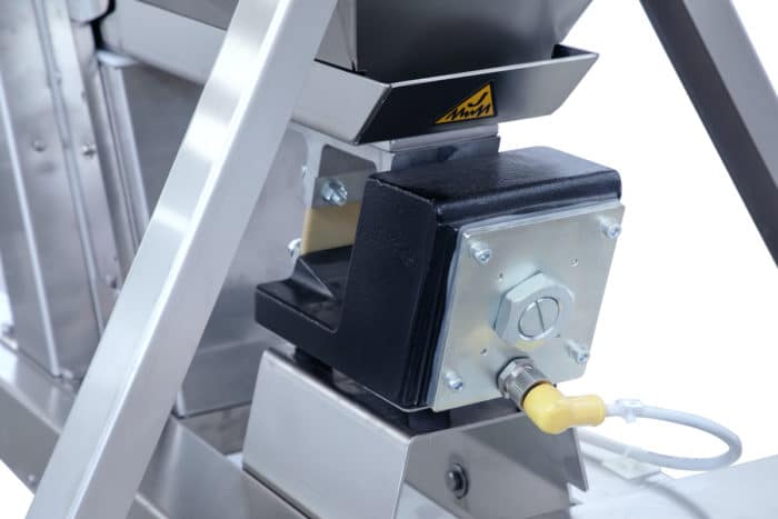 Bottom vibrator for cap elevator