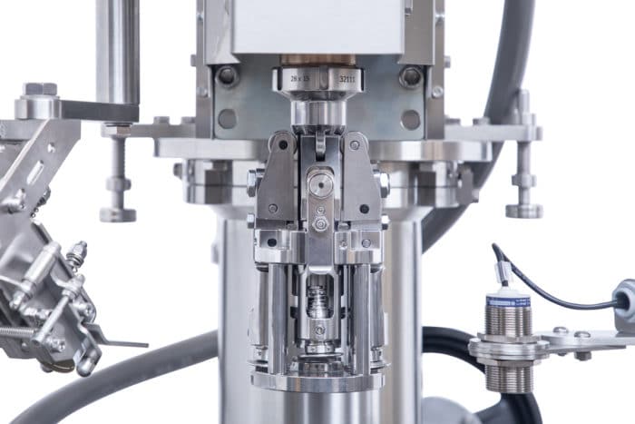 Revolving twin function turret capper — ROPP detail