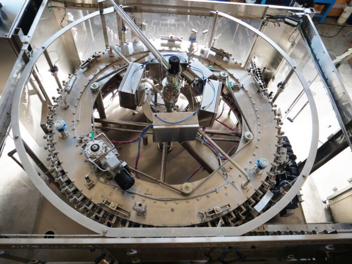 Electro-pneumatic can filler carousel overhead view