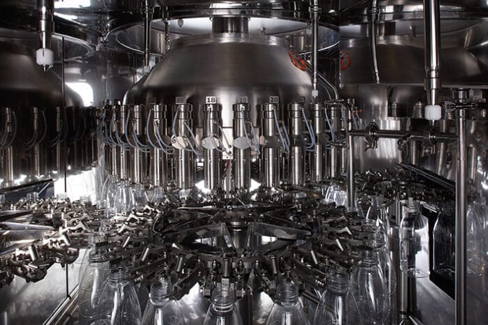 Weight filling: Food & Sauce Rotary Filler detail, neck handling for PET bottles